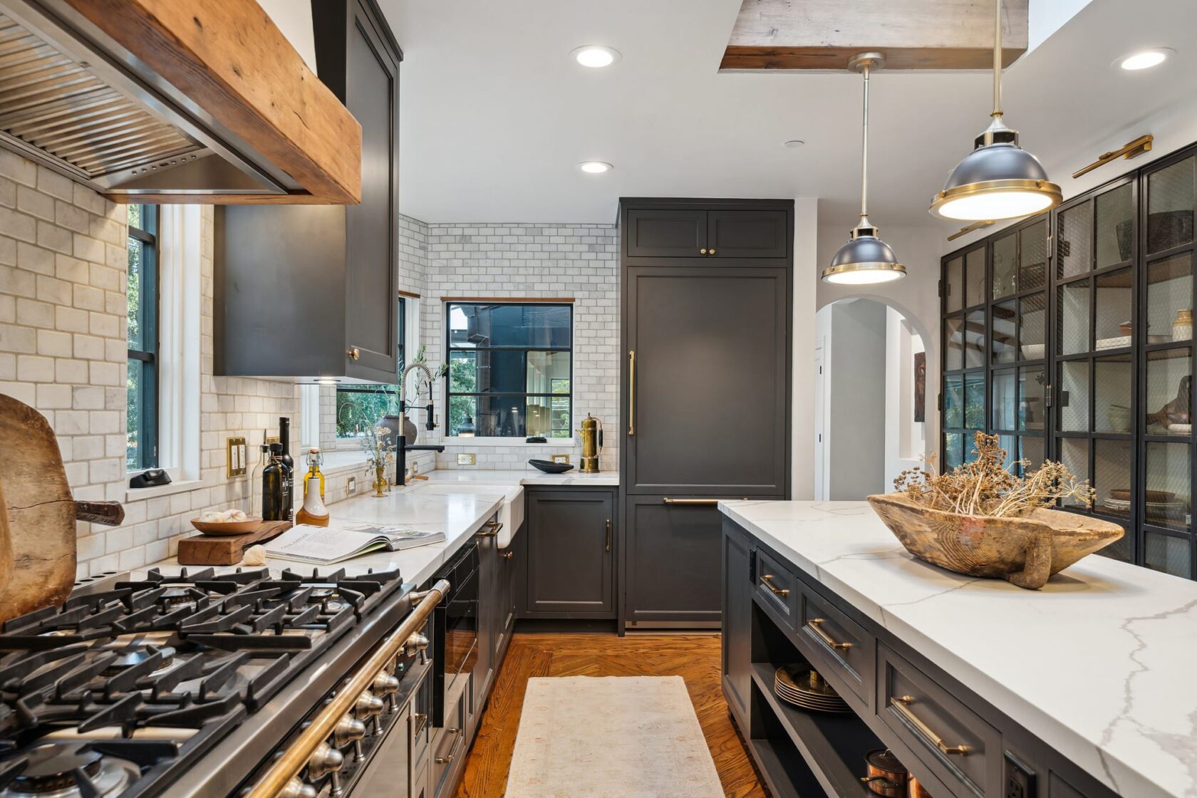 Charcoal kitchen with La Cornue range, marble island, and pendant lights at 137 Oak Knoll Avenue, San Anselmo