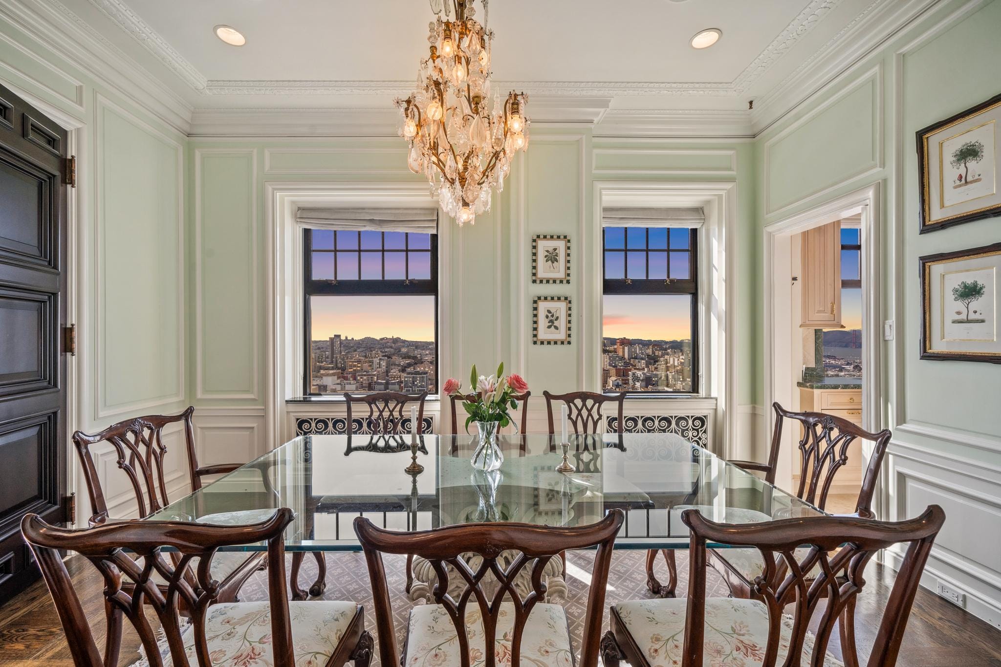 Twilight shot of the dining room of 1201 California Street Unit 1602 in the Cathedral Apartments