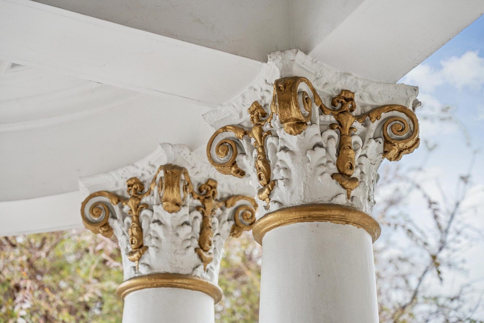 Corinthian Capitals with Gold Accents on the Front Porch
