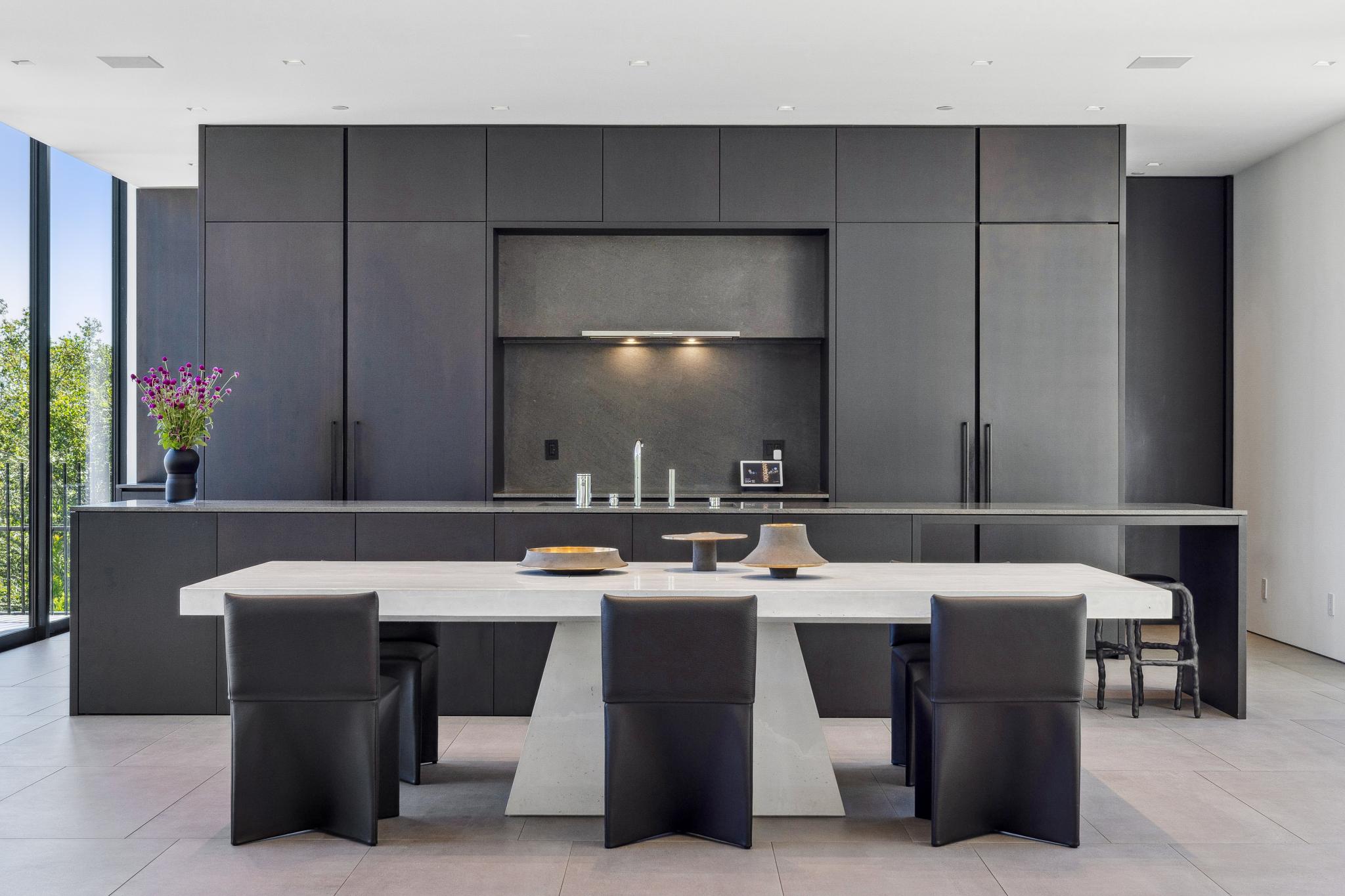 Floor-to-ceiling matte black cabinetry with integrated Sub-Zero and Fisher & Paykel appliances at 185 Summit Avenue, Mill Valley