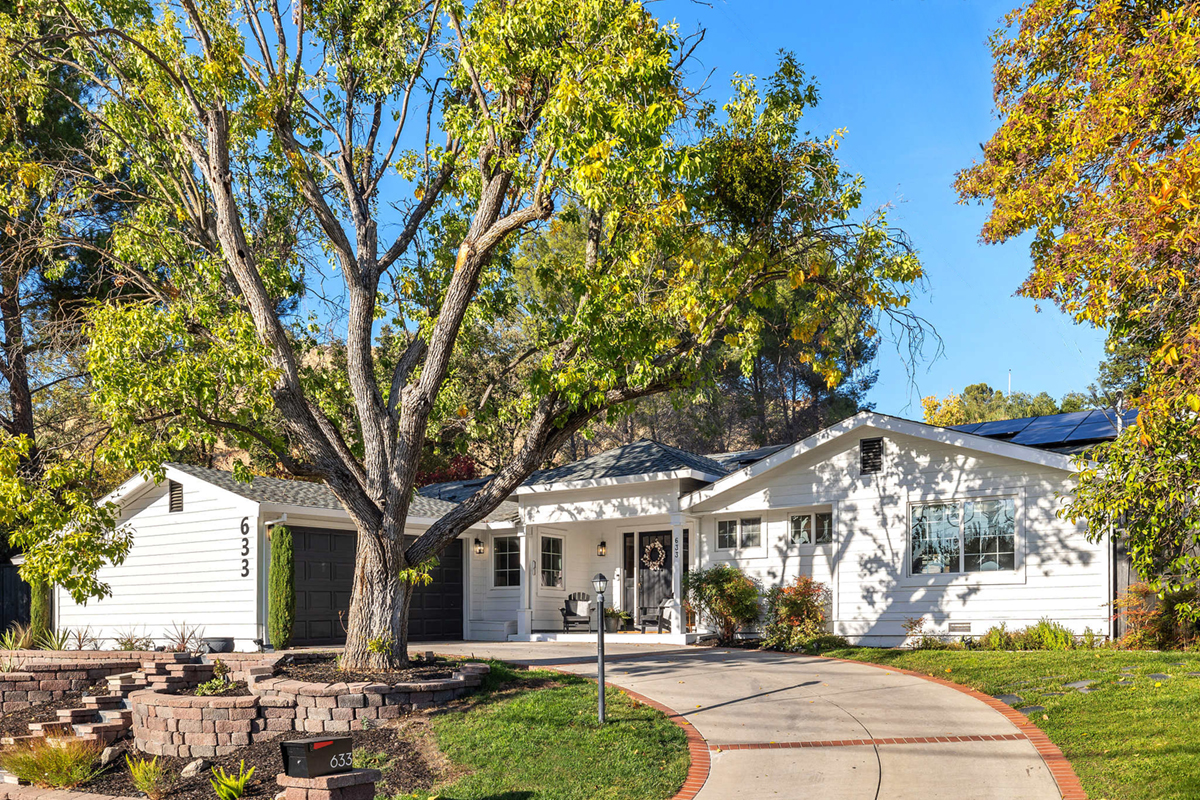 Home exterior with wires removed and grass filled in